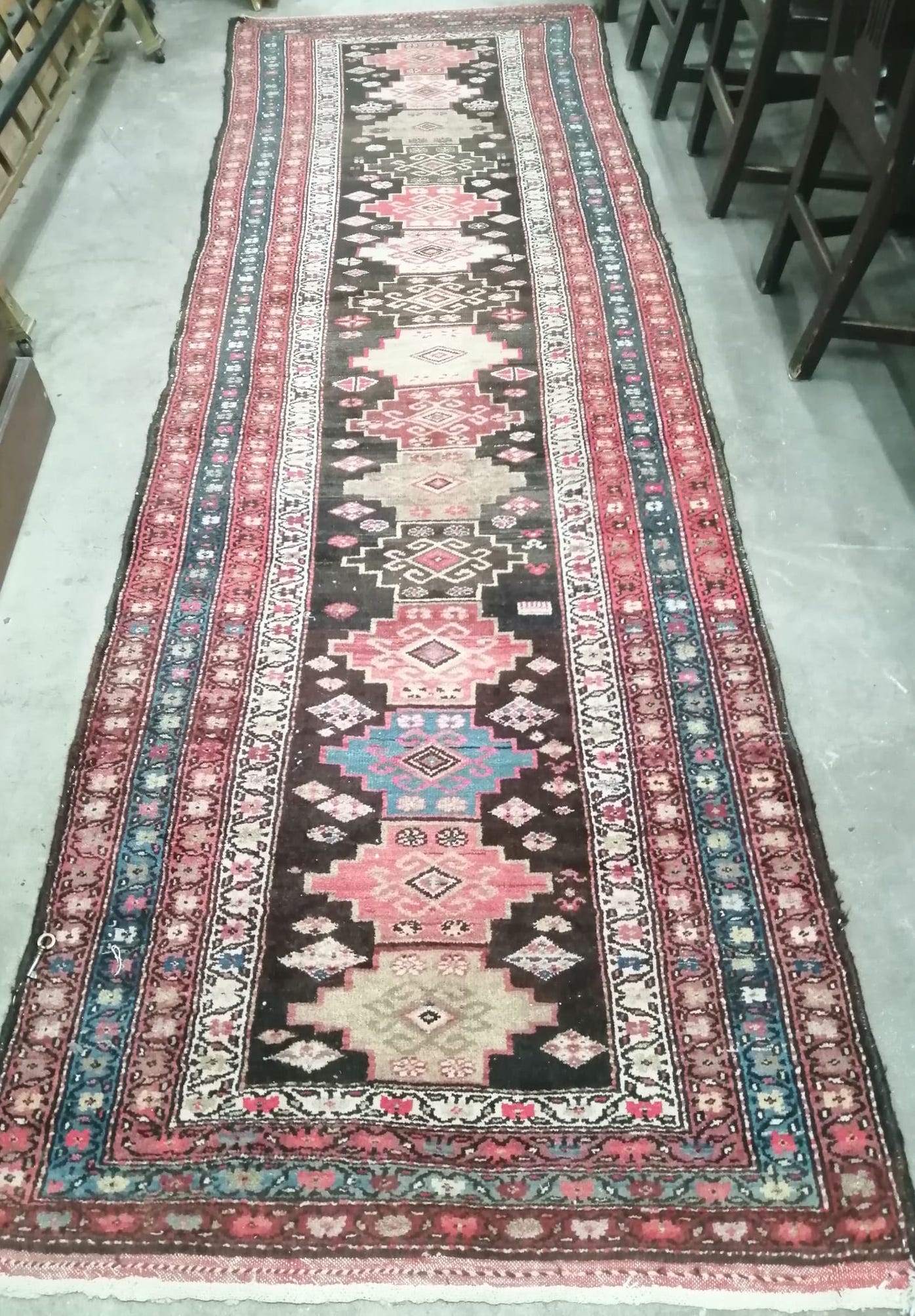 A Caucasian geometric runner, 320 x 101cm